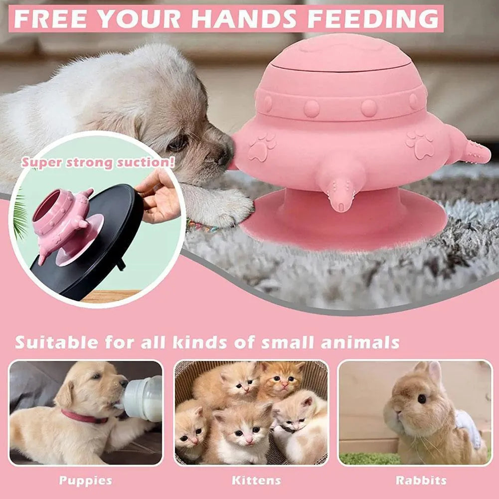 Pink silicone pet milk feeder with four nursing nipples for puppies and kittens on a flat base.