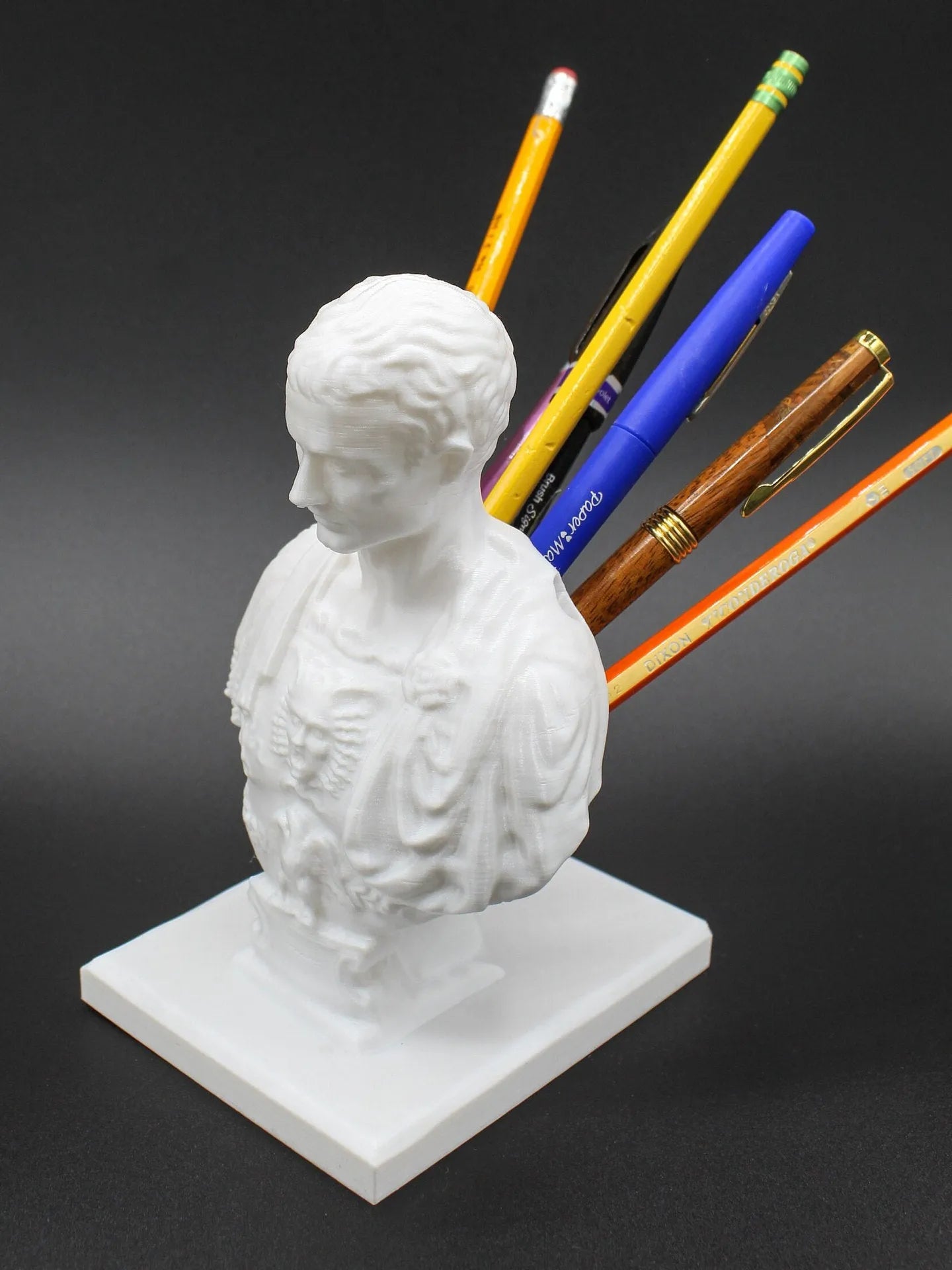 White synthetic resin character modelling pen holder with American creative design