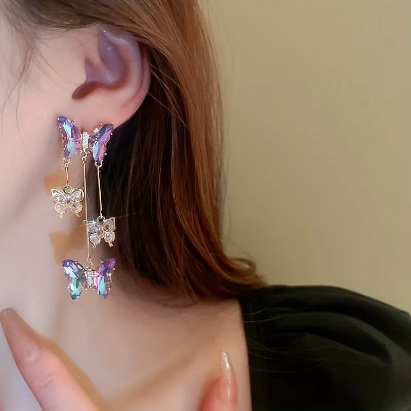 Silver needle crystal flowers butterfly tassel earrings in blue purple colour on alloy hooks