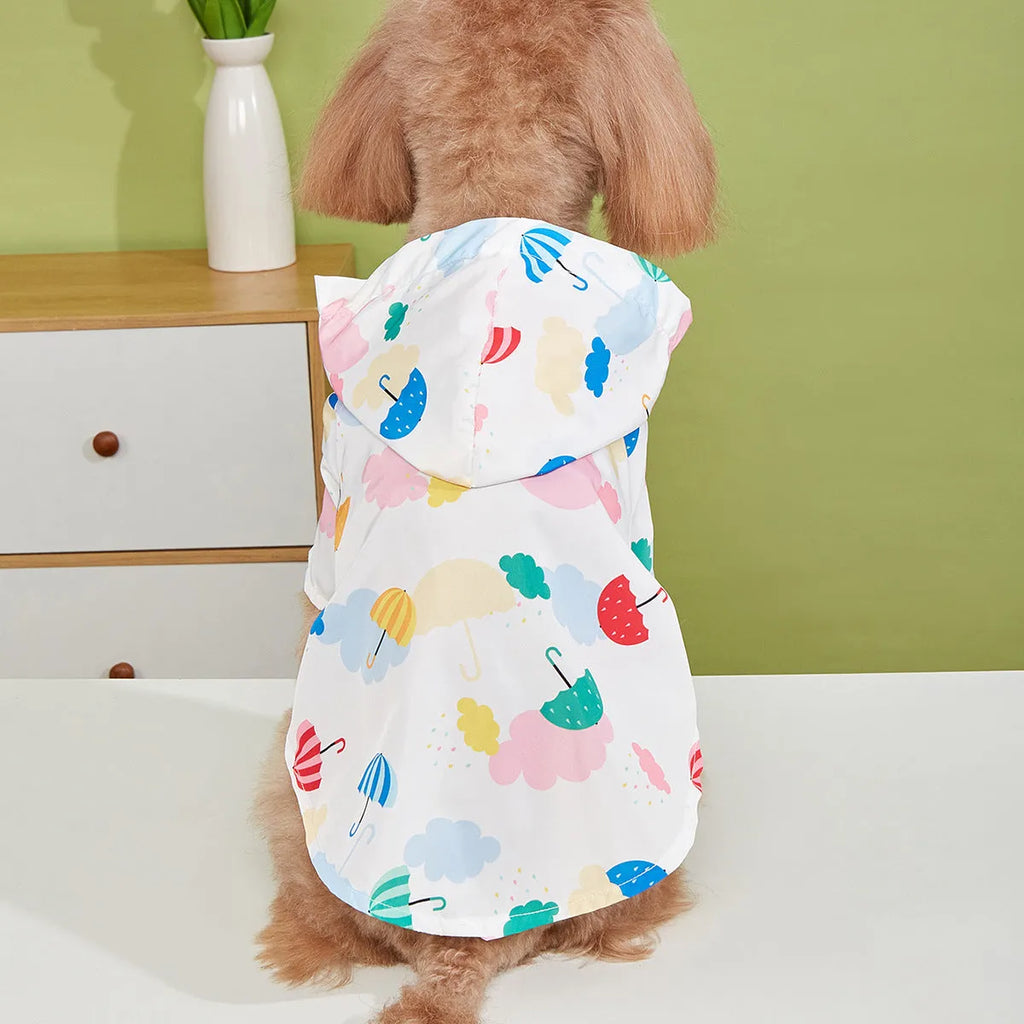 Colourful cartoon umbrella print dog raincoat in polyester fabric on a model dog.