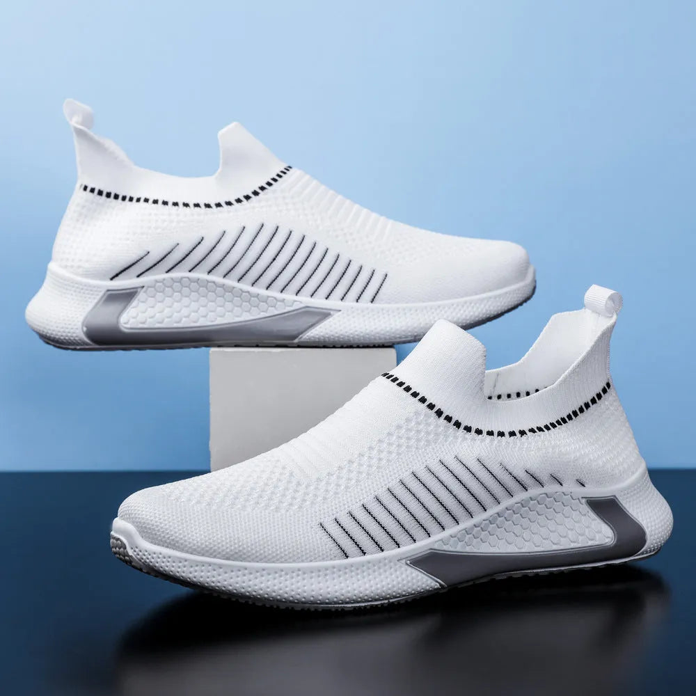 Men's black and white striped mesh sock shoes with Flyknit upper and lace-up front.