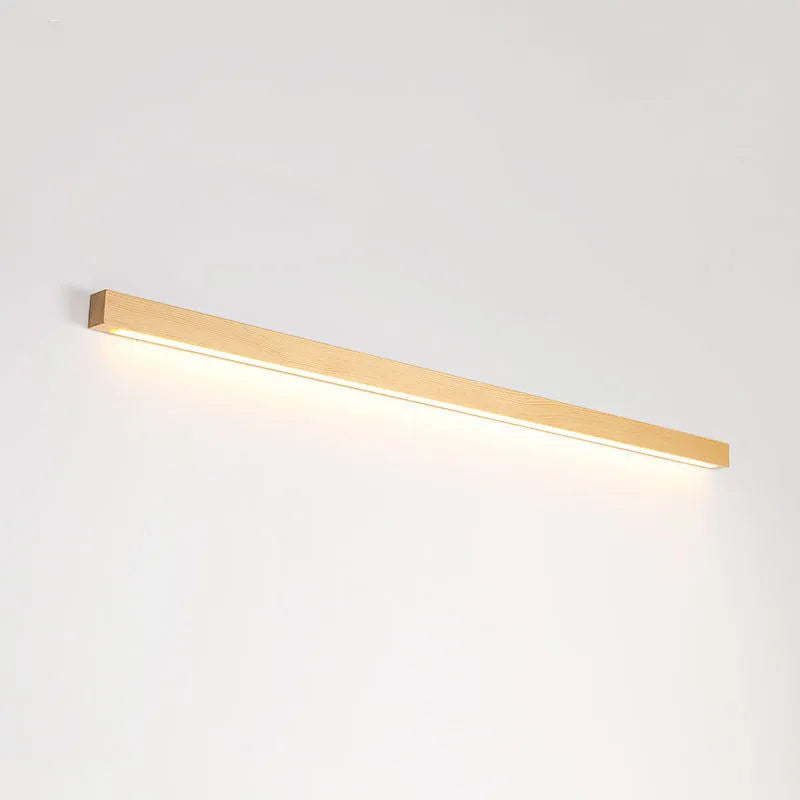 Walnut colour wooden log design LED strip wall lamp in three lengths on a modern wall.
