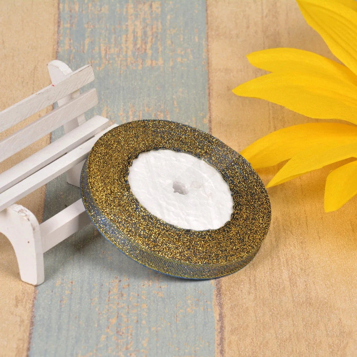 Green onion coloured polyester ribbon with gold polka dots on 25-yard spool for decorative trimming