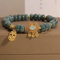 Women's natural emerald jade bracelet with alloy construction showing abacus bead design and safety lock closure