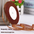 Roll of 0.6cm wide polyester gift ribbon in multiple colour options including gold leaf and red onion.