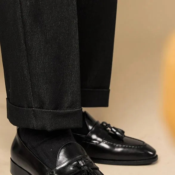 Men's black and brown polished leather tassel loafers with rubber sole