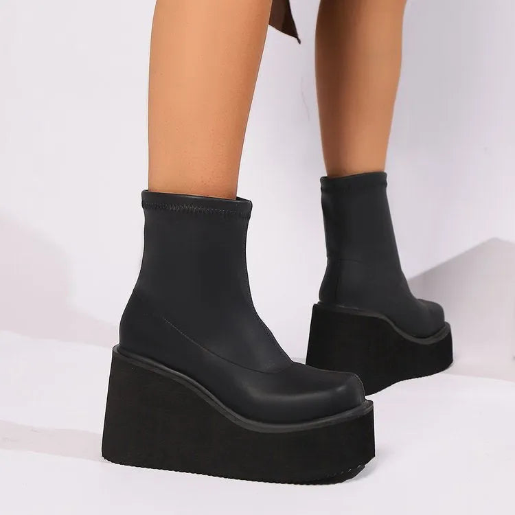 Black plus size women's boots with wedge heel and waterproof platform in short and high shaft styles