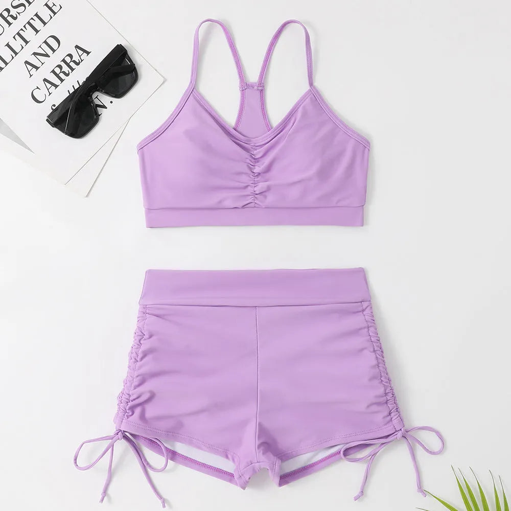 Women's high waist split swimsuit bikini in black or violet colours for swimming activities