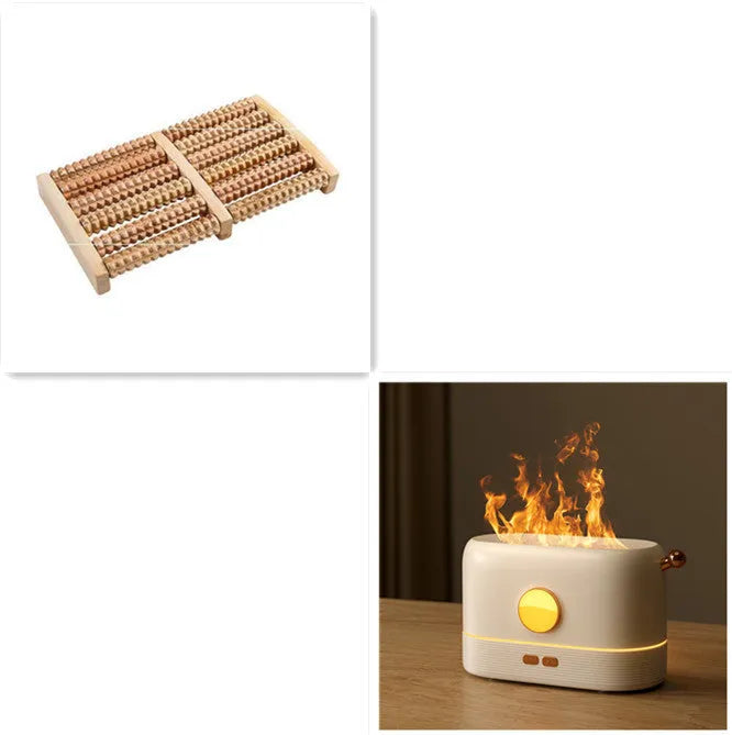 Black USB desktop humidifier with LED flame effect and water tank on a wooden desk.