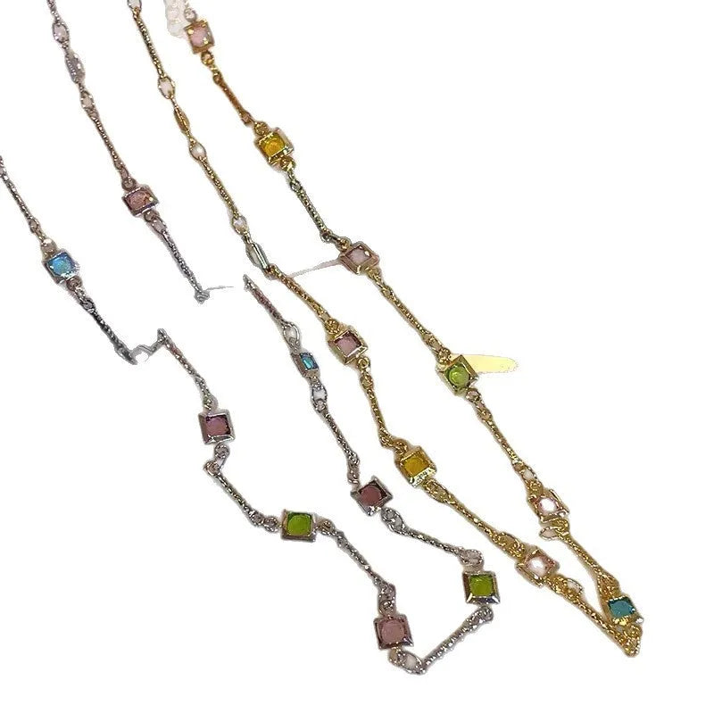 Square geometric artificial crystal pendant on clavicle-length alloy chain necklace in gold tone