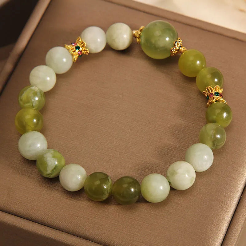 Original design women's bracelet made from green Xiuyan jade in a sweet Mori style.