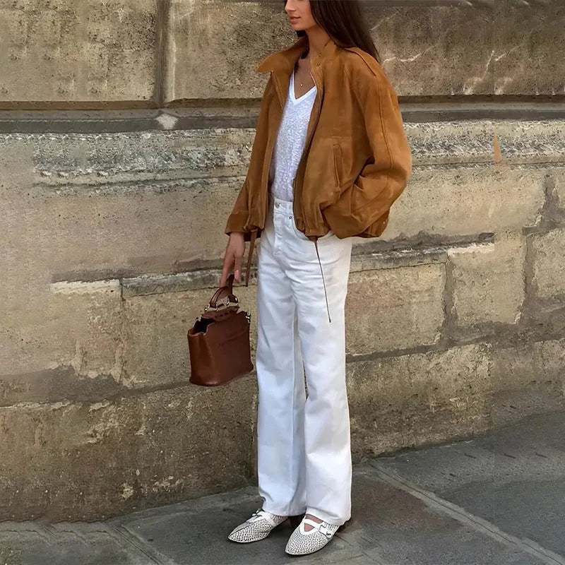 Retro-style loose-fit solid colour jacket with long sleeves on a hanger.
