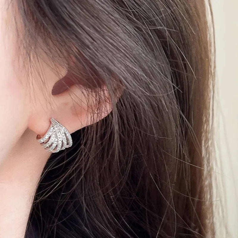 Women's geometric zircon earrings with platinum electroplated finish and clean line design