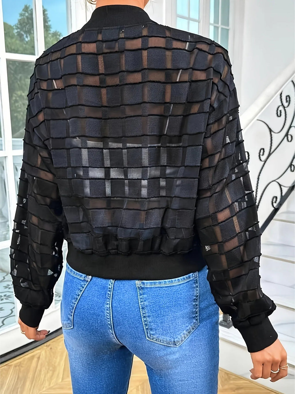 Black women's casual jacket with geometric pattern and semi-transparent thread zipper.