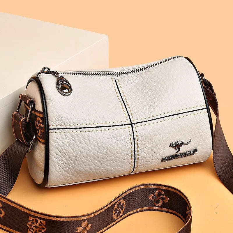 Casual genuine leather cylindrical shoulder bag for women in black, top grain, patchwork, soft texture.