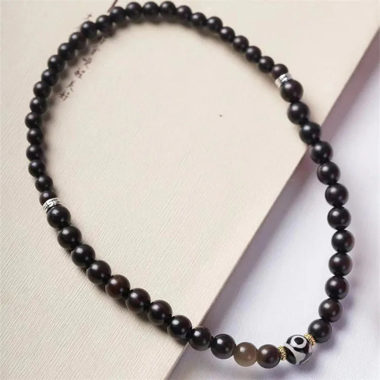 Ebony Tibetan bracelet with two circular beads in 8mm unisex sizing