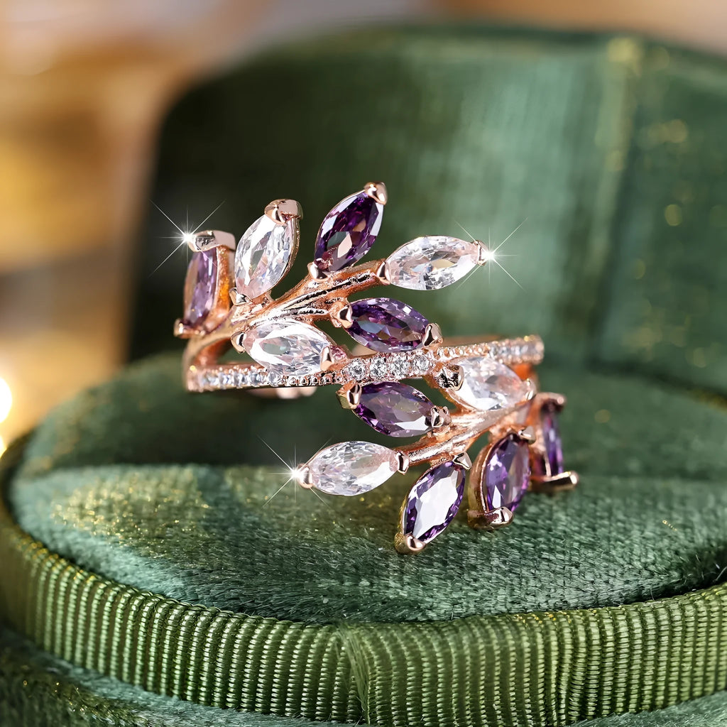Copper leaf-shaped ring with adjustable band and central horse eye zircon stone in a choice of colours.