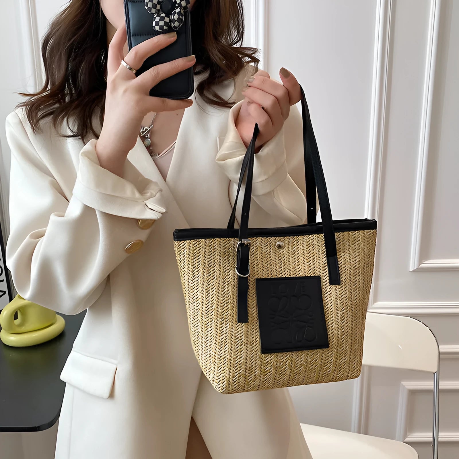 Straw woven women's shoulder bag in black with three-dimensional pockets and 27cm width