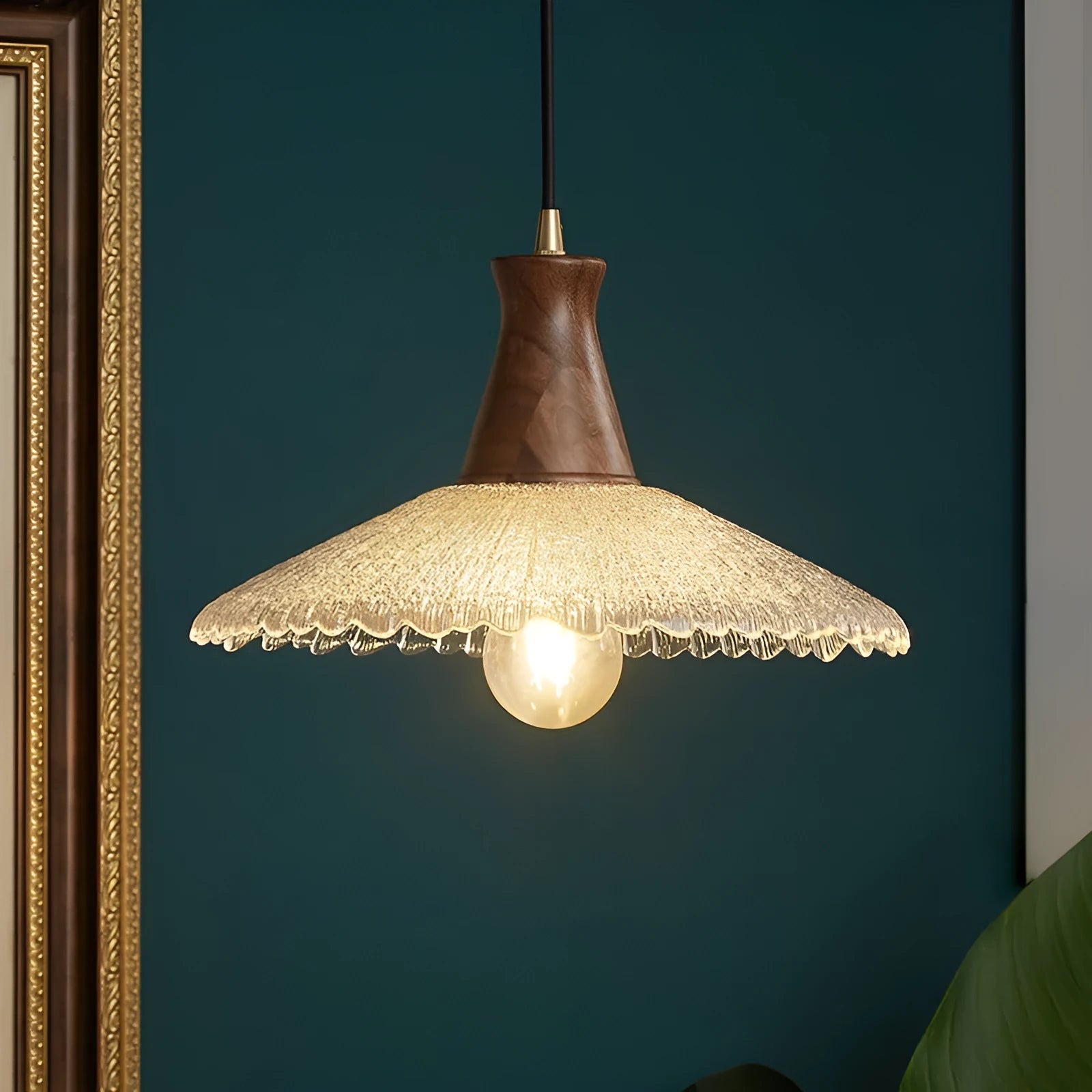 Retro-style brass and glass chandelier with a wooden frame hanging from a ceiling.