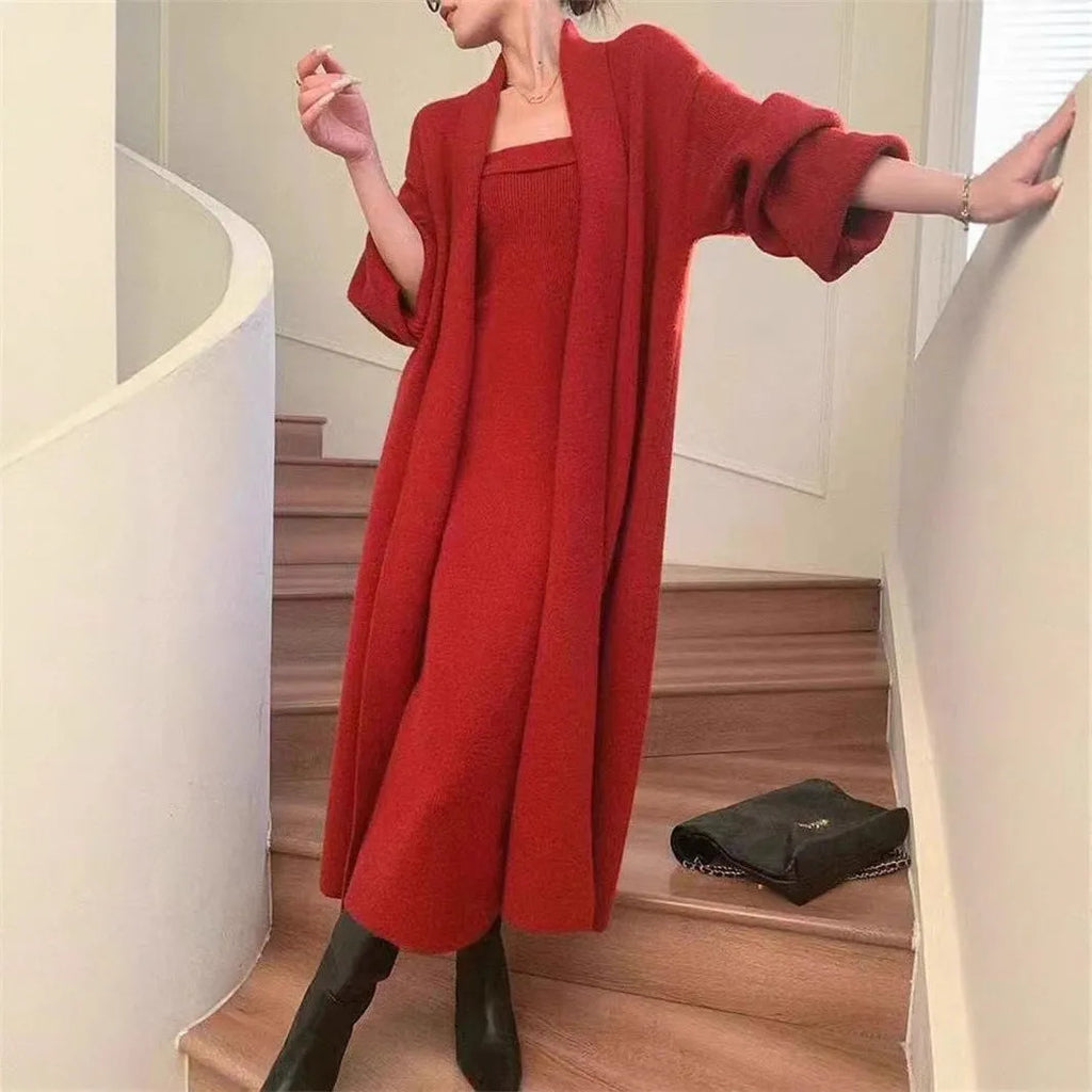Women's grey knitted dress and matching coat suit with flocked pattern, long skirt, and regular sleeves.