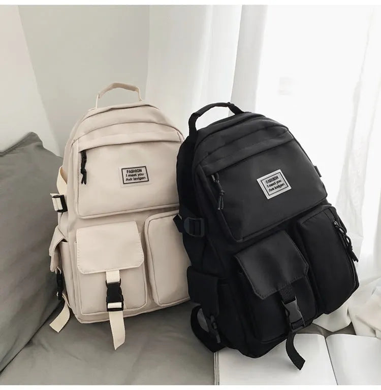 Black student backpack with three-dimensional pockets showing computer compartment