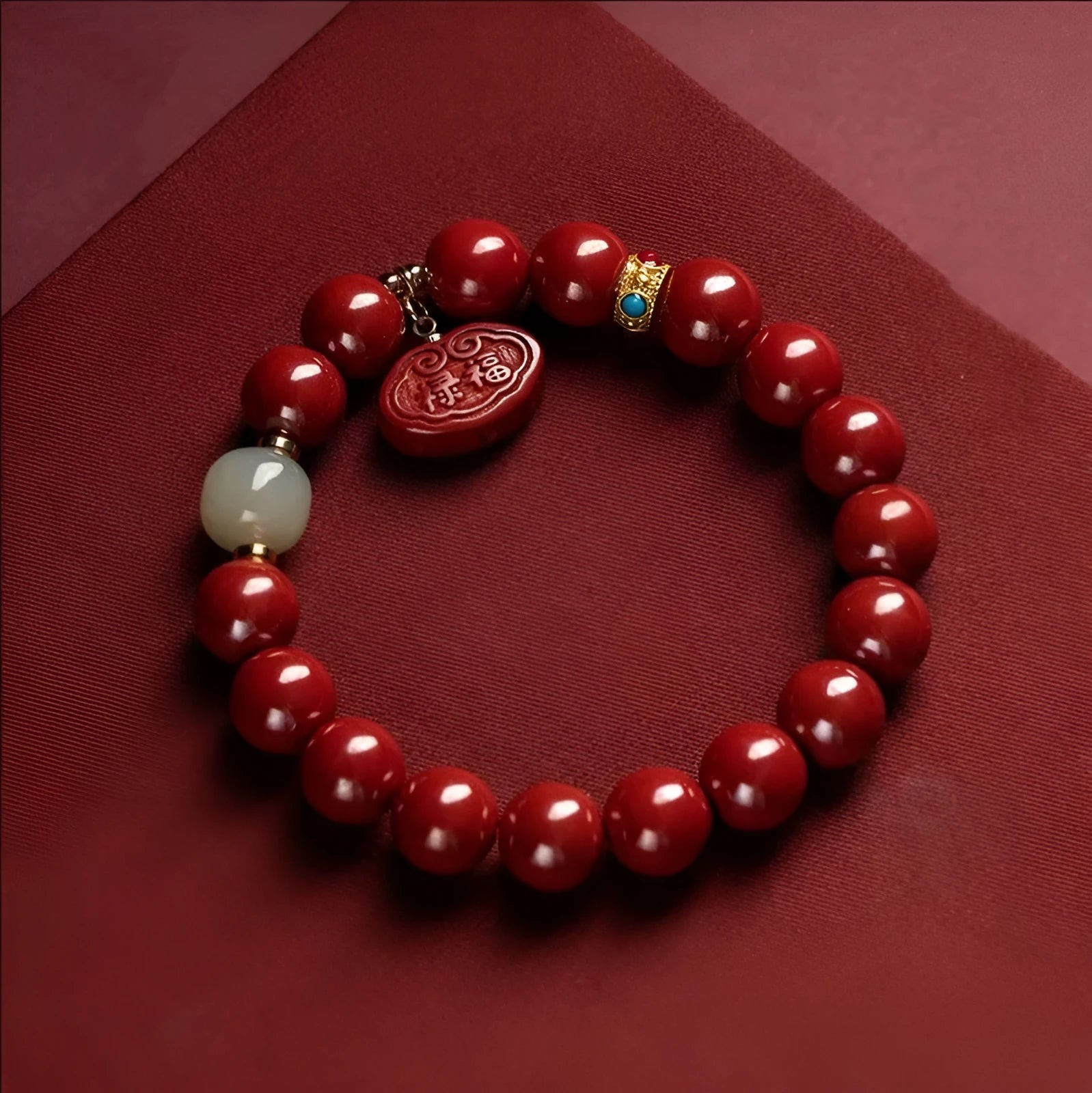 Natural cinnabar Emperor Sandstone Ping An Fu Lu bracelet with red beads.