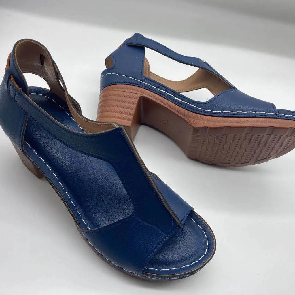 Roman style women's wedge sandals with open peep toe, buckle detail, and a low heel, shown in multiple colours.