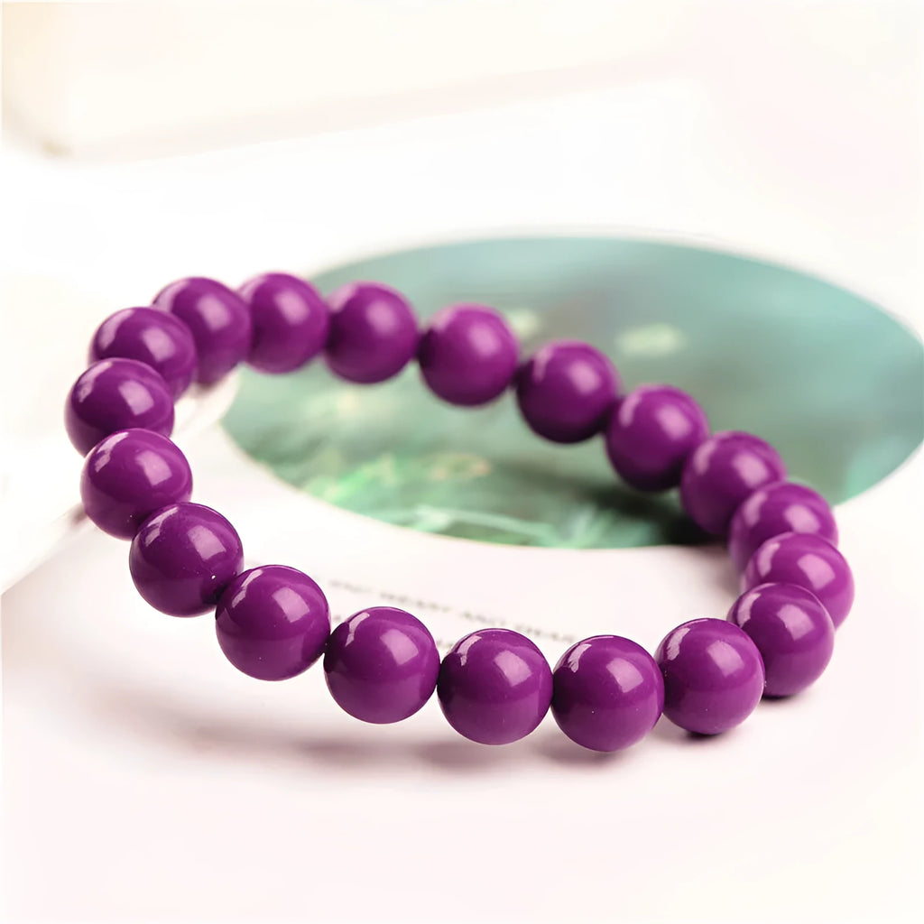 Jiuya polished purple mica crystal bracelet in a single circle design on a wrist.