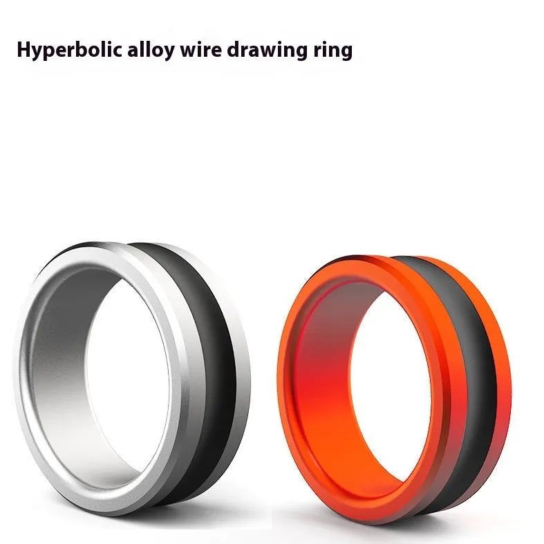 Orange alloy fishing hand guard pull loop tool for hook extraction on a wooden surface.