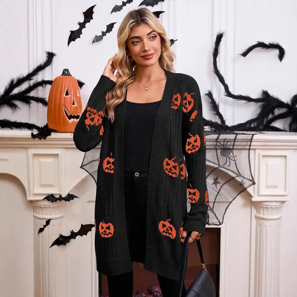 Women's black Halloween cardigan with orange pumpkin head jacquard knit pattern.
