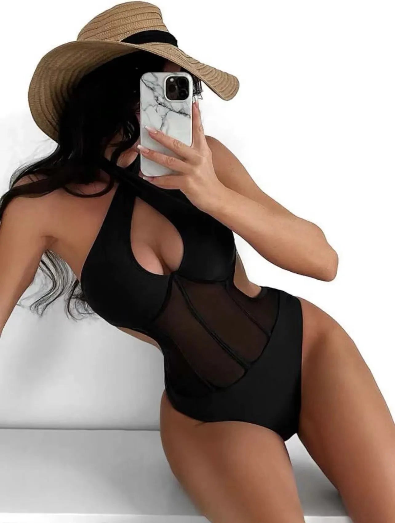 Women's black one-piece bikini swimsuit with nylon-spandex fabric on mannequin