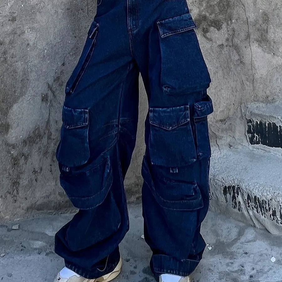 Distressed dark blue wide-leg jeans with high waist and multiple pockets on mannequin