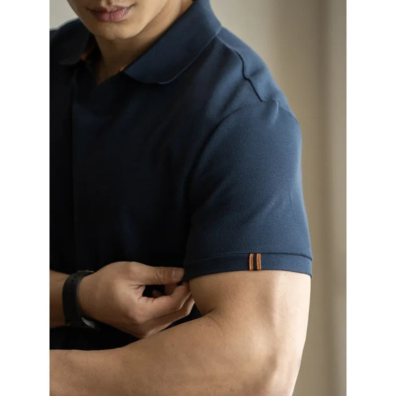 American-style light blue cotton blend short-sleeve polo shirt laid flat, showing regular fit and button placket.