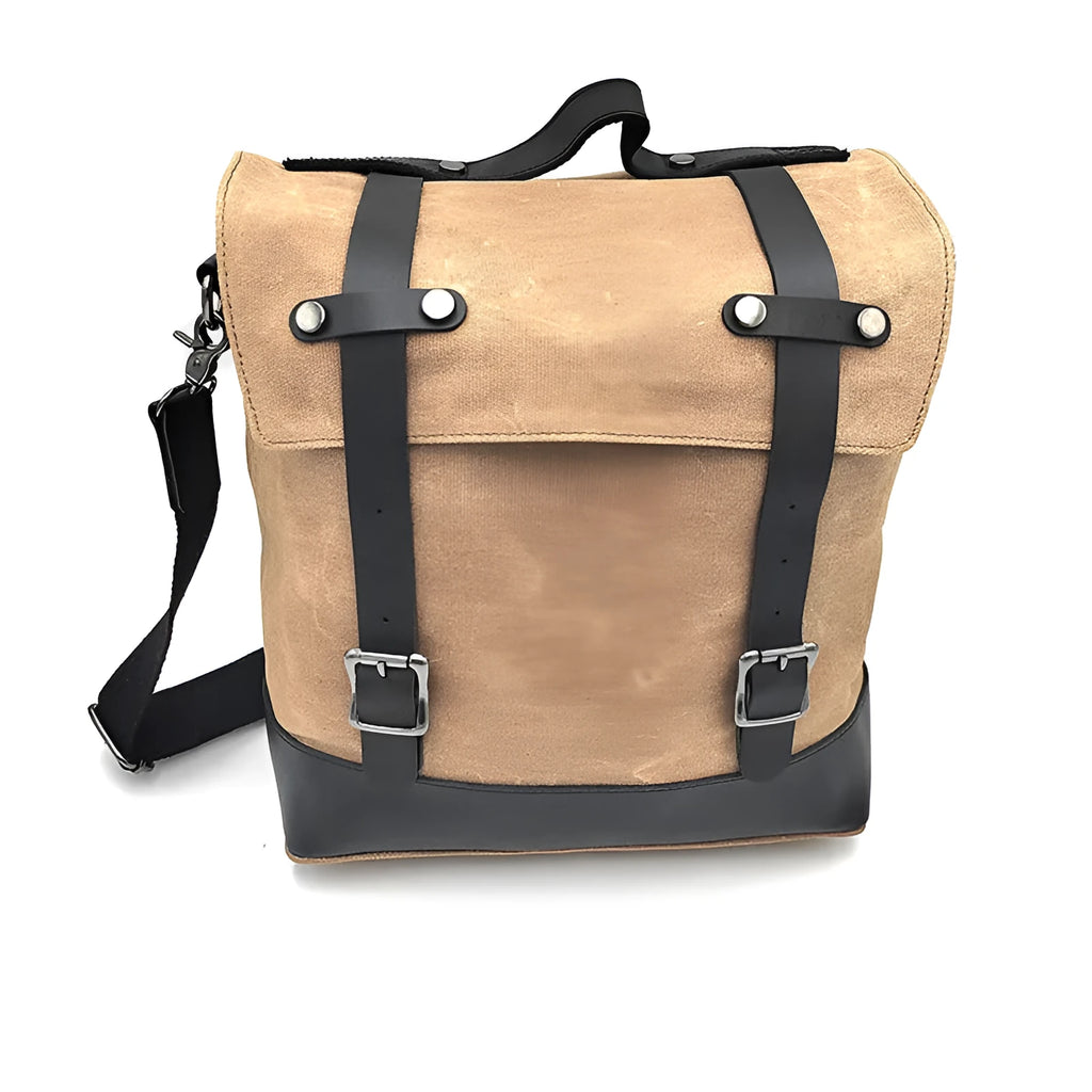Black waterproof canvas motorcycle side pannier bag with cowhide reinforcement mounted on motorcycle