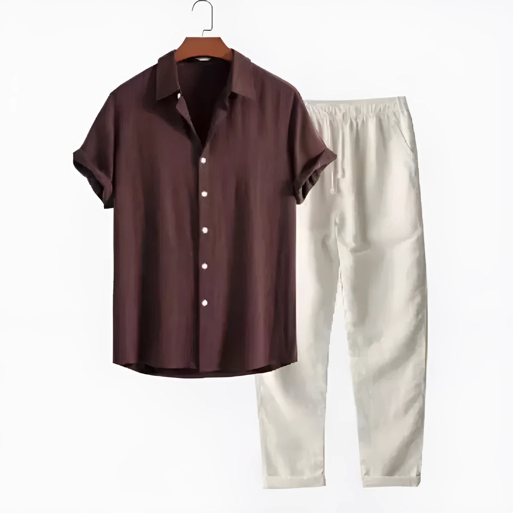 Man wearing a loose-fit linen-blend short sleeve shirt and matching casual trousers from a co-ord suit set.