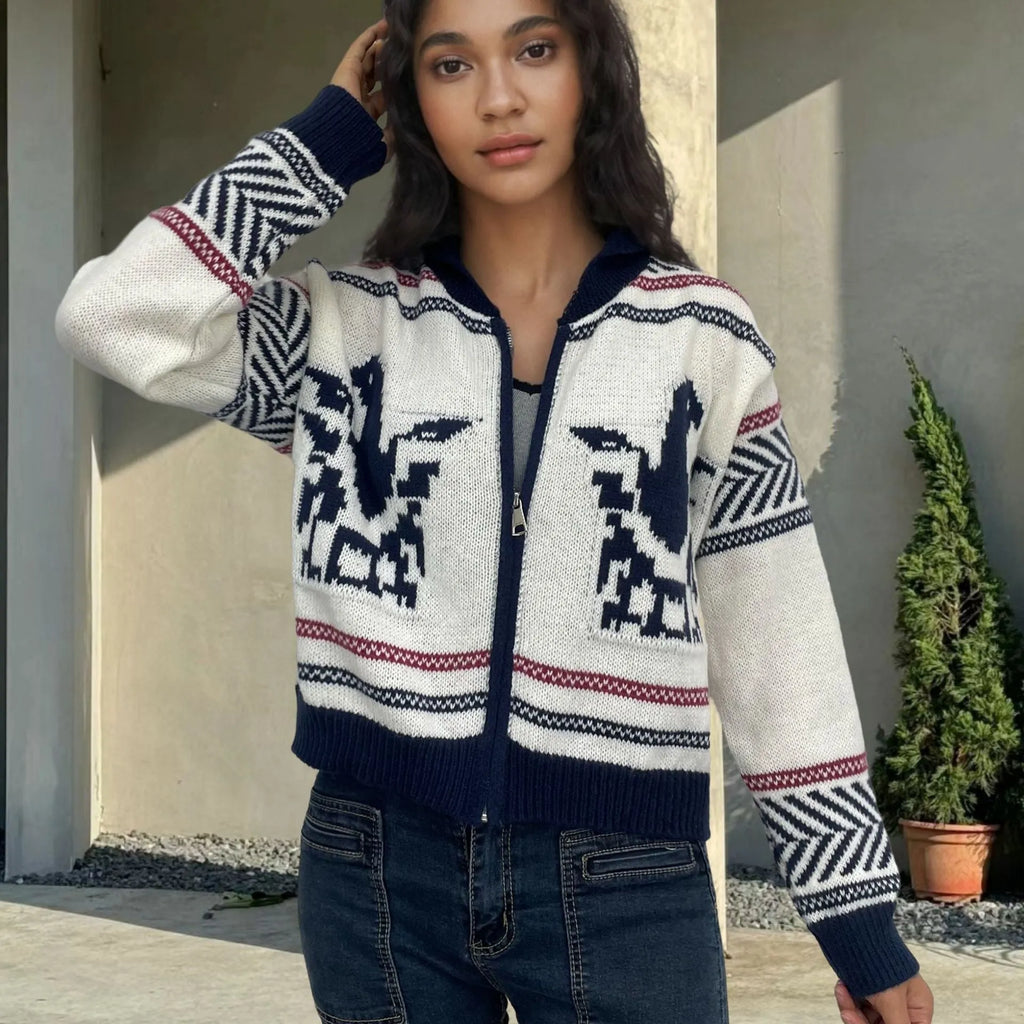 White women's jacquard cardigan with contrast stripes, zipper front, and lapel collar on a hanger.