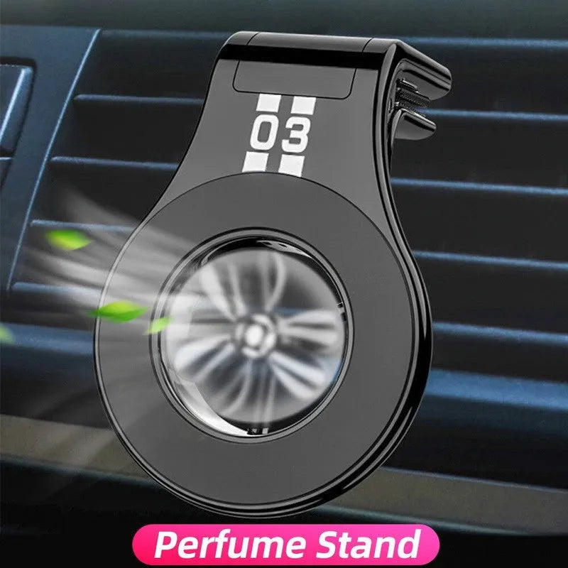 Magnetic car phone holder mounted on air vent with smartphone attached and perfume slices