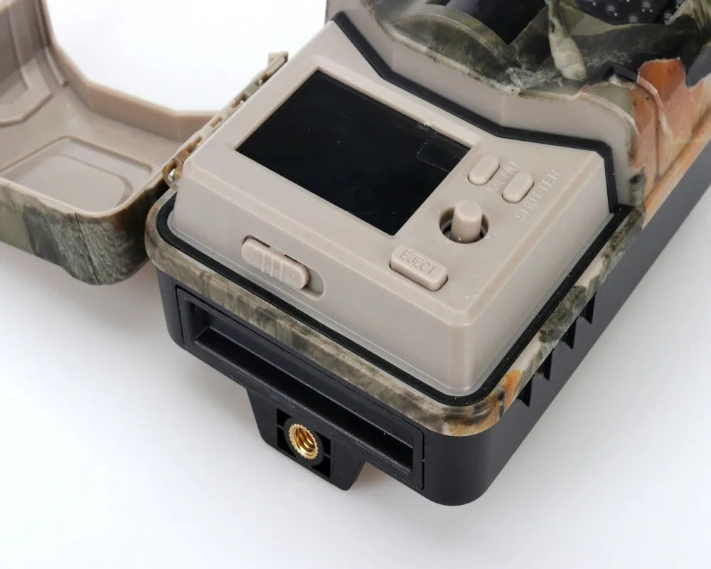 Camouflage outdoor hunting camera with infrared LEDs showing compact 16cm design for wildlife monitoring