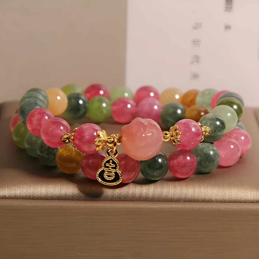Natural jade colour tourmaline crystal double ring bracelet for women with Buddha head charm on white background