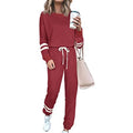 Women's loose-fitting plus size casual suit in a solid colour, featuring a half-sleeve top and trousers.