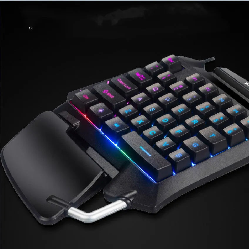 Black one-handed left-hand gaming keyboard with integrated wrist rest and USB connector for desktop mobile gaming