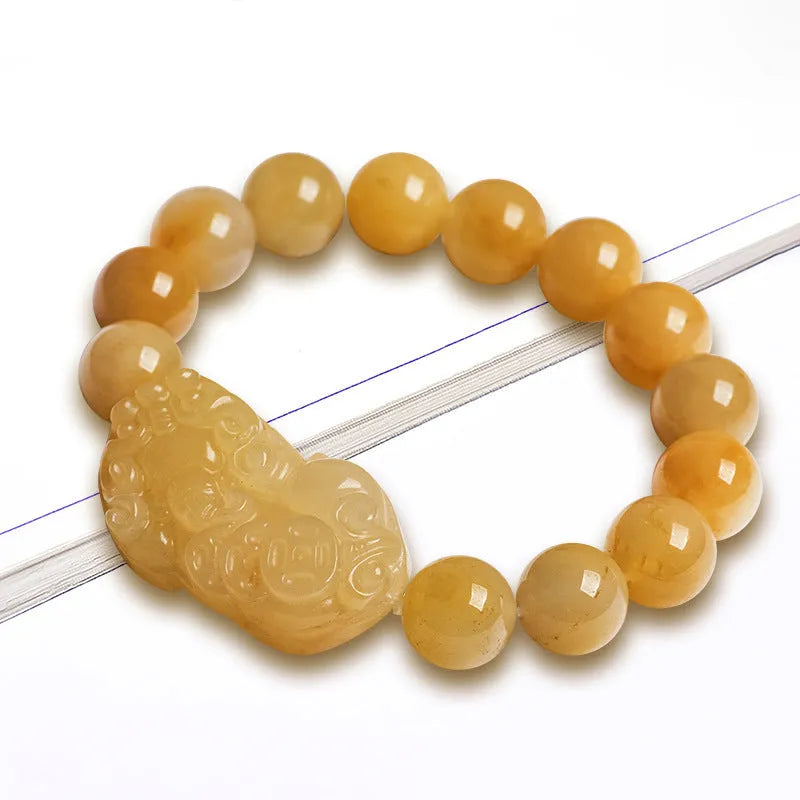 Hand-carved Jinsi Jade money bracelet with traditional coin pendant in golden-threaded stone