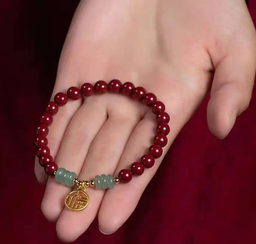 Handmade wave-shaped bracelet made from cinnabar and copper beads in a national unisex style.