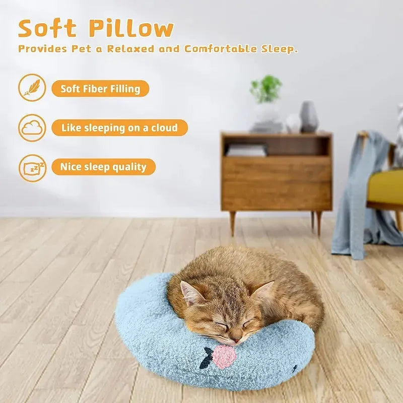 Small U-shaped plush pet pillow in blue for cats and small dogs, showing quilted faux fur texture.