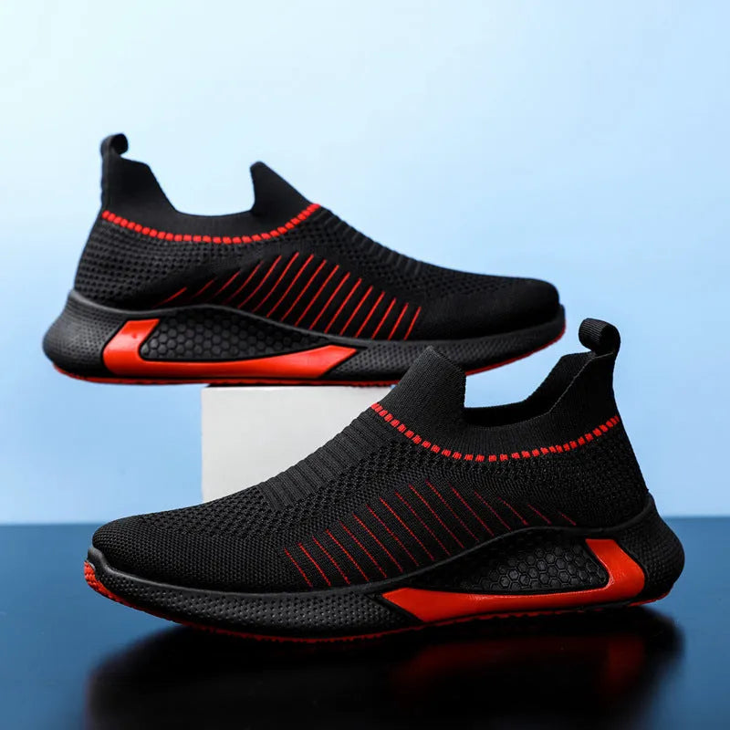 Men's black and white striped mesh sock shoes with Flyknit upper and lace-up front.