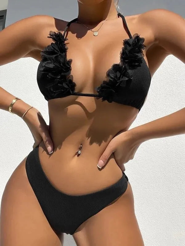 Black women's gathered two-piece polyester swimsuit bikini set on a mannequin