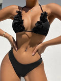 Black women's gathered two-piece polyester swimsuit bikini set on a mannequin