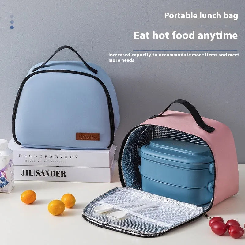 Textured cloth insulated lunch bag in sapphire blue colour with bento handbag design