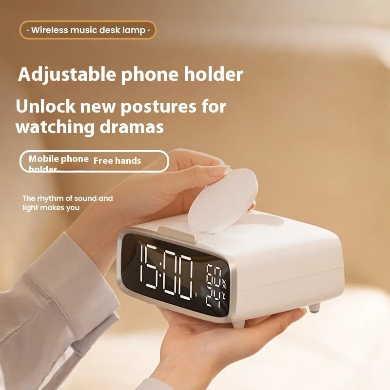 White Bluetooth speaker wireless charger with night light functionality on bedside table