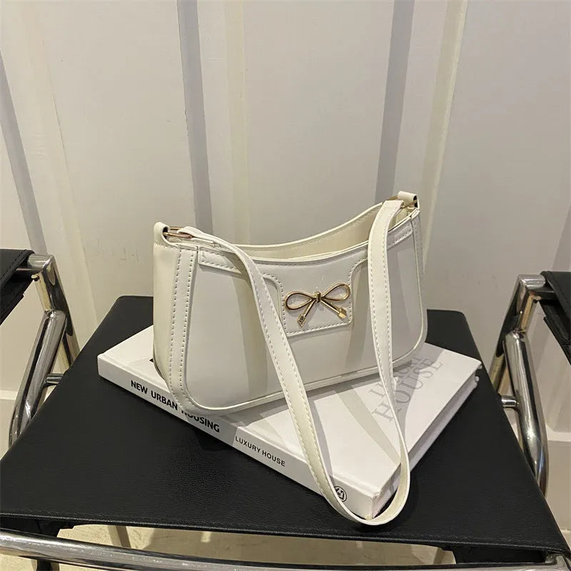 PU leather shoulder bag with bow detail in horizontal square shape showing rose red colour option